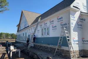 MJM crew installing exterior siding